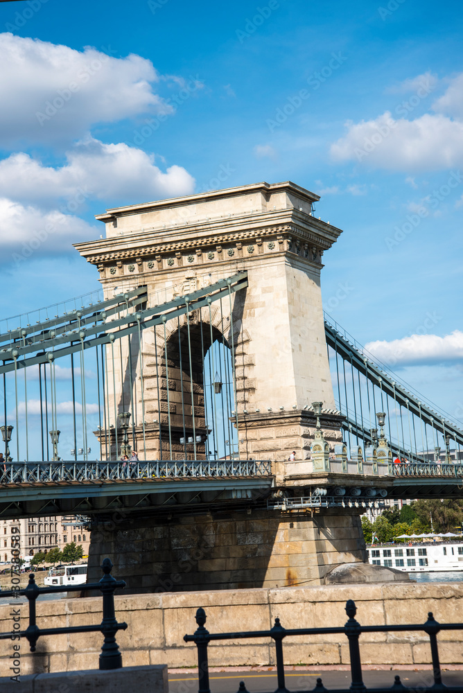 Obraz premium Budapest the Capital city of Hungary is divided by the River Danube.The Chain Bridge opened in 1849 was designed by UK engineer William Tierney Clark