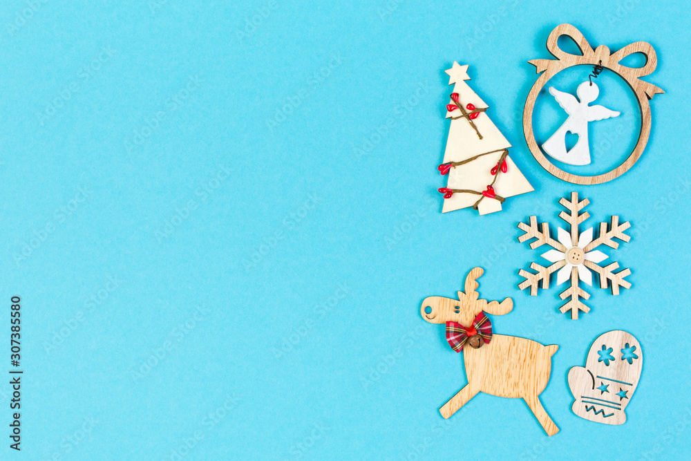 Fototapeta premium Top view of festive composition made of New Year decorations on colorful background. Merry Christmas concept with empty space for your design