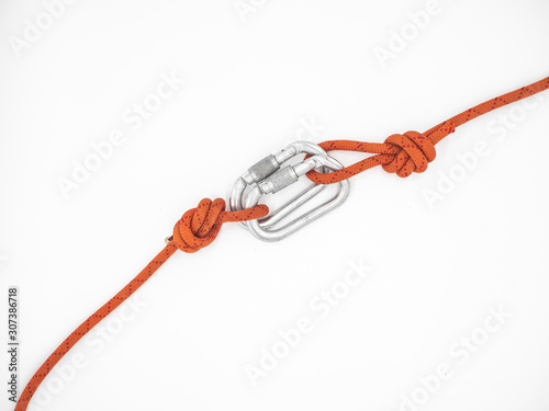Two ropes connected by two carabiners. Couple of the silver carabiners with lock and two red ropes isolated on white.