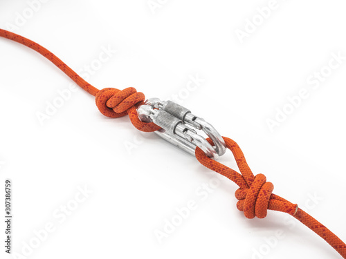 Two ropes connected by two carabiners.  Couple of the silver carabiners with lock and two red ropes isolated on white.