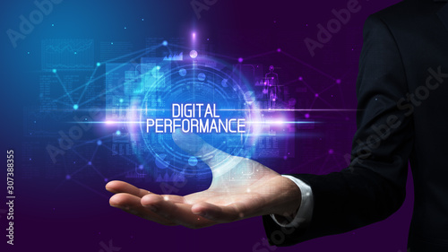 Man hand holding DIGITAL PERFORMANCE inscription, technology concept