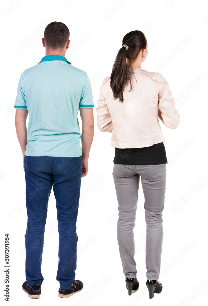 Back view of couple. beautiful friendly girl and guy together. Back view of couple. beautiful friendly girl and guy together.