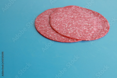 slices of salami in colorful background