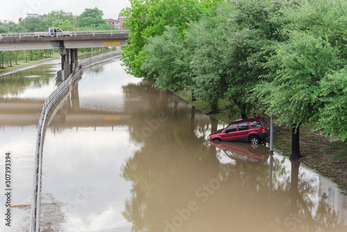 Red car swamped by high water near downtown Houston, Texas