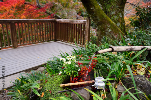 Chozusha for wash hands and rinse mouth at the entrance of shrine photo