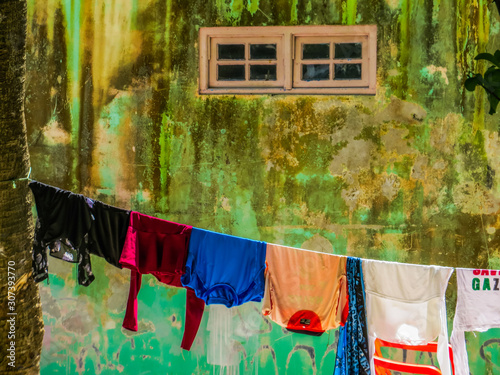 Clothes hanging out to dry in the village of Villingili, Maldives © Diego Fiore