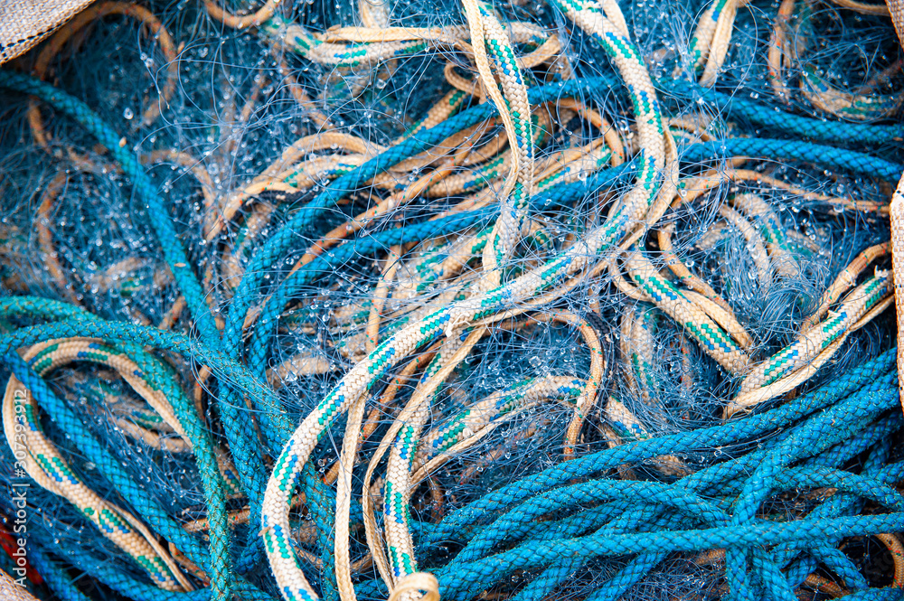 Blue ropes and fishing net in the big sack Blue ropes and fishing net in the big sack