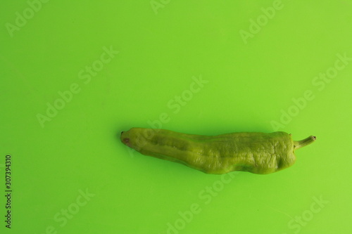 green pepper on colorful background