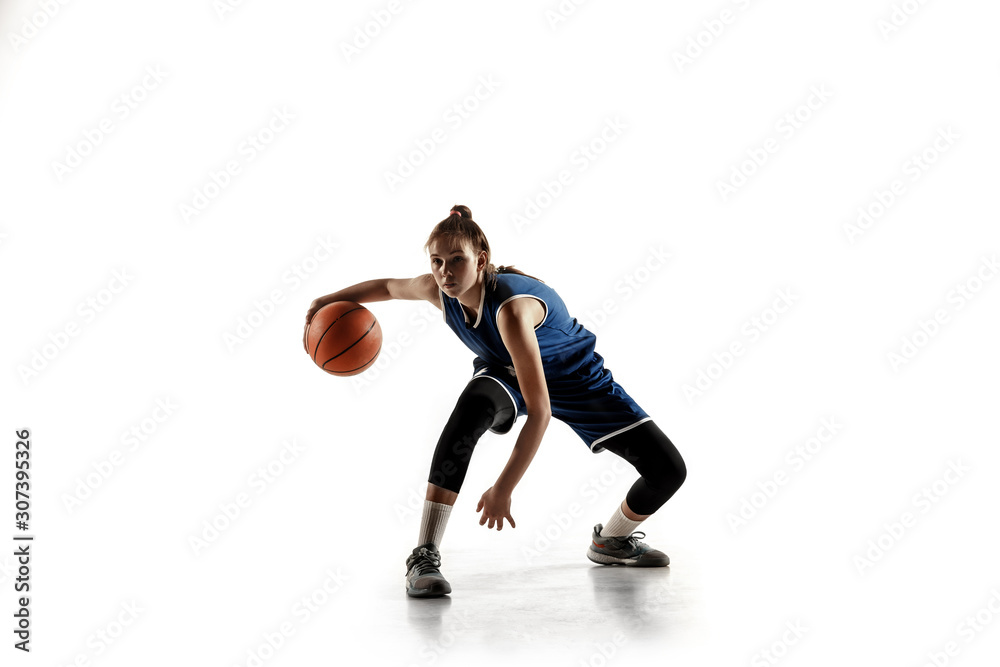 Young caucasian female basketball player of team in action, motion in run isolated on white background. Concept of sport, movement, energy and dynamic, healthy lifestyle. Training, practicing.