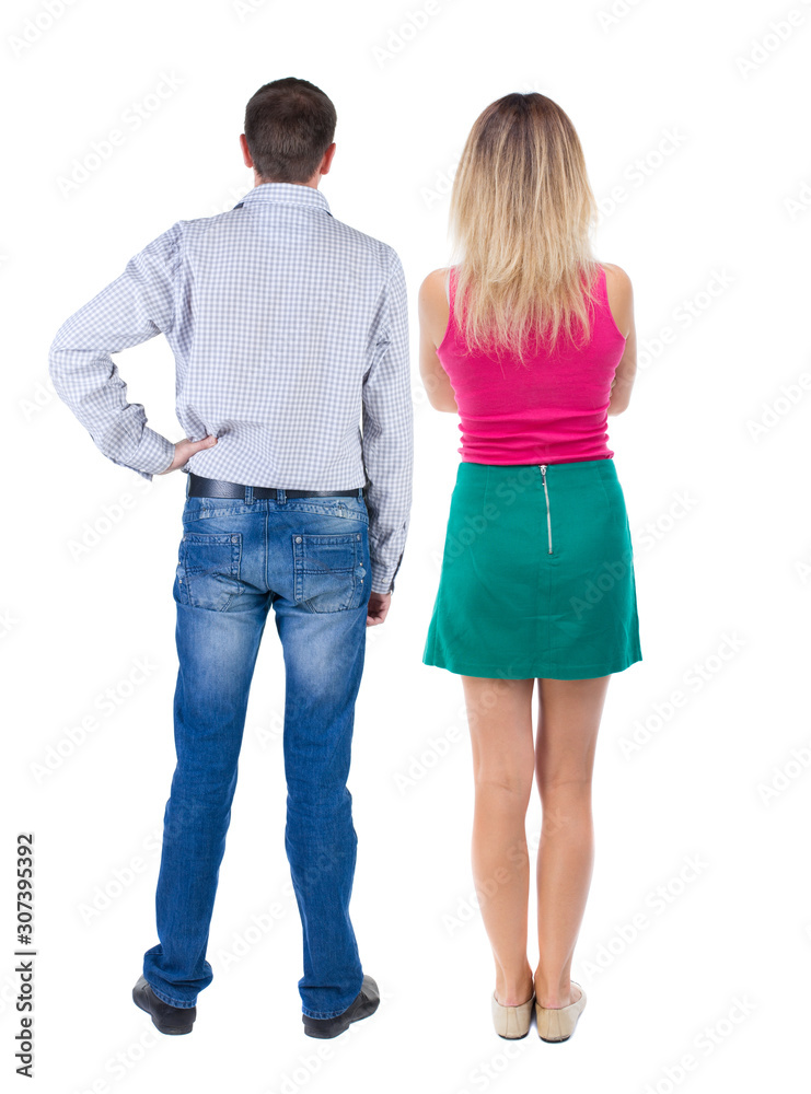 Back view of couple. beautiful friendly girl and guy together. Back view of couple. beautiful friendly girl and guy together.