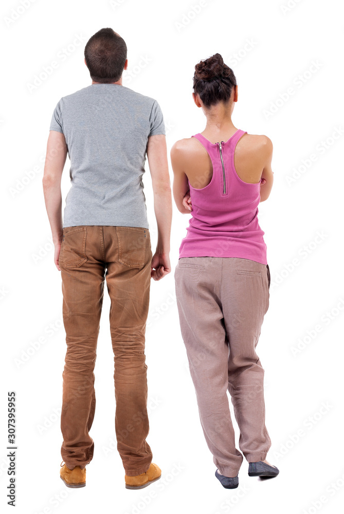 Back view of couple. beautiful friendly girl and guy together. Back view of couple. beautiful friendly girl and guy together.