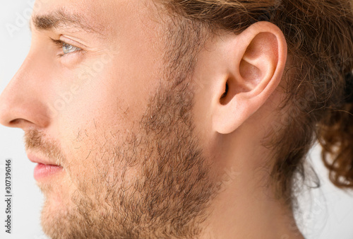 Young man with hearing prob...