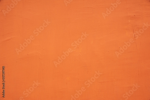 Surface of orange plaster on the wall