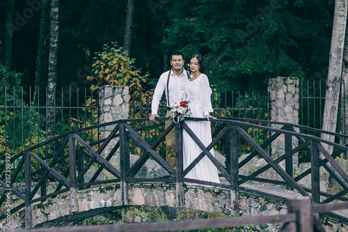 stylish young couple in rustic style. rustic wedding