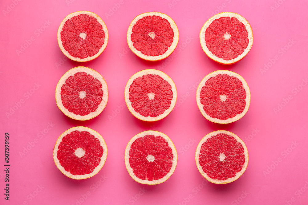 Fresh cut grapefruit on color background