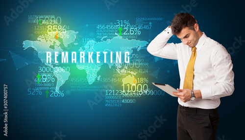 Businessman in front of a decision with REMARKETING inscription, business concept