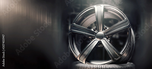 Tableau sur toile beautiful black alloy wheels made of aluminum on a dark background