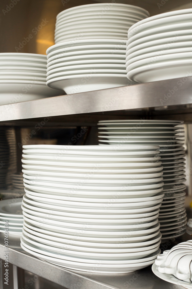 stack of white plates in the kitchen