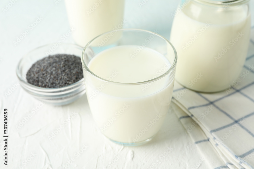 Glass of chia milk and chia seeds on blue background, space for text. Closeup Glass of chia milk and chia seeds on blue background, space for text. Closeup