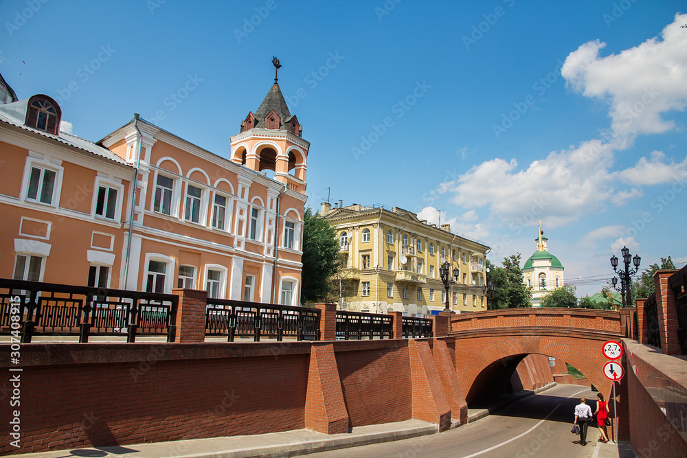 Naklejka premium Old stone bridge of red bricks in old historic city street of Voronezh in Russia.