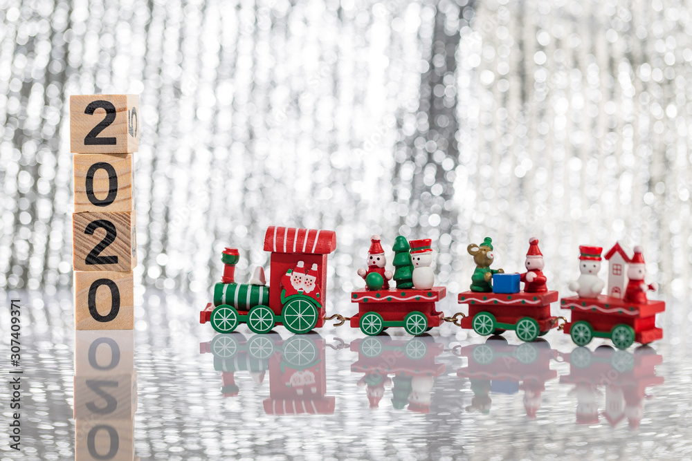 The toy train on the desk and the building block with the word 2020 The toy train on the desk and the building block with the word 2020