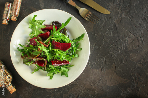 salad beetroot, leaf mix (beet, lettuce, arugula, red chard and more) menu concept. food background. top view. copy space