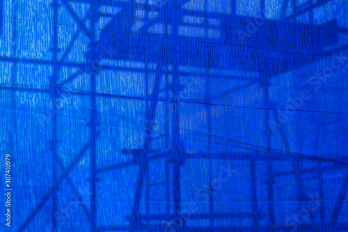 Fotomurale blue canvas covering the building Under construction facade