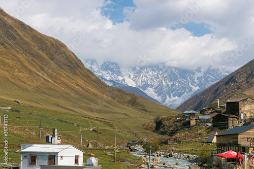 Ushguli village on a background of snow-capped mountains in Svaneti in the mountainous part of Georgia