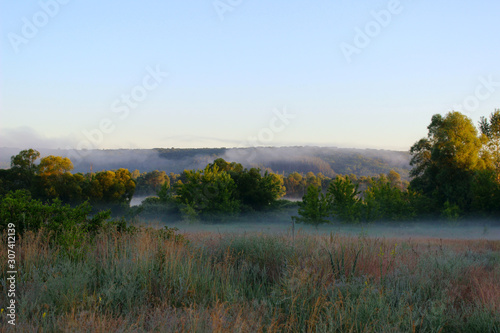 Blurred image of a beautiful landscape. Abstract nature background. Nature, fog, landscape concept.