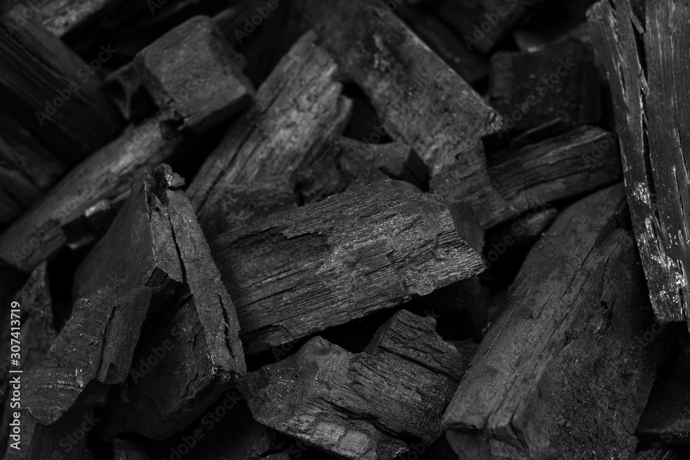 Natural fire ashes with dark grey black coals texture. It is a flammable black hard rock. Space for text. Natural fire ashes with dark grey black coals texture. It is a flammable black hard rock. Space for text.
