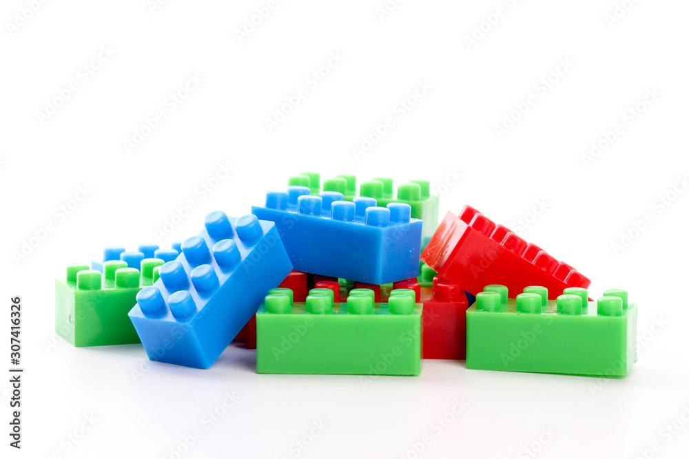 Fototapeta premium Plastic toy block over white background