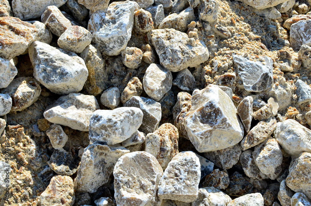 Natural gray gypsum stone. Close up image of stones with black and white. Industrial mining area. Limestone mining, quarry - Imagen