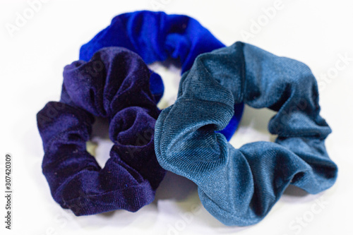 Three Blue Scrunchies on a Bright White Background 