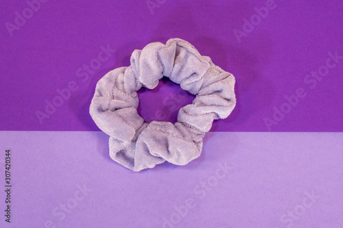 Light Purple Scrunchie on Two Tone Purple Background photo
