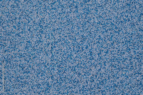 Blue background texture from marble chips. Plaster texture.