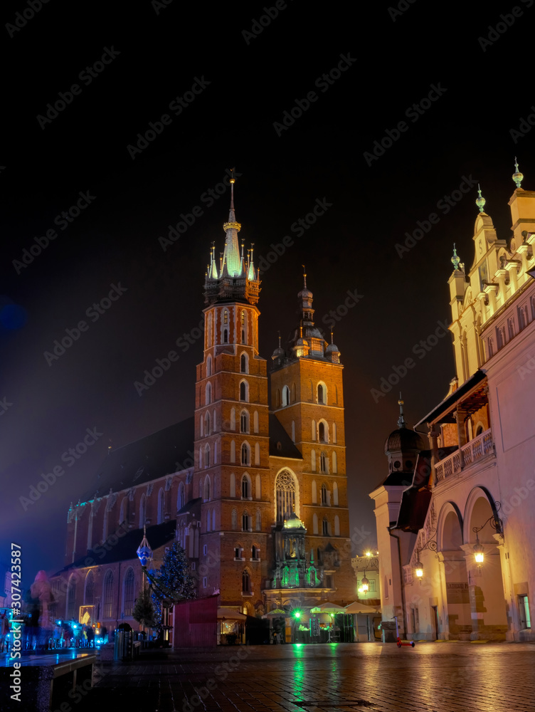 Fototapeta premium Historic ancient market square in Krakow. Cloth Hall and Mariacki Church