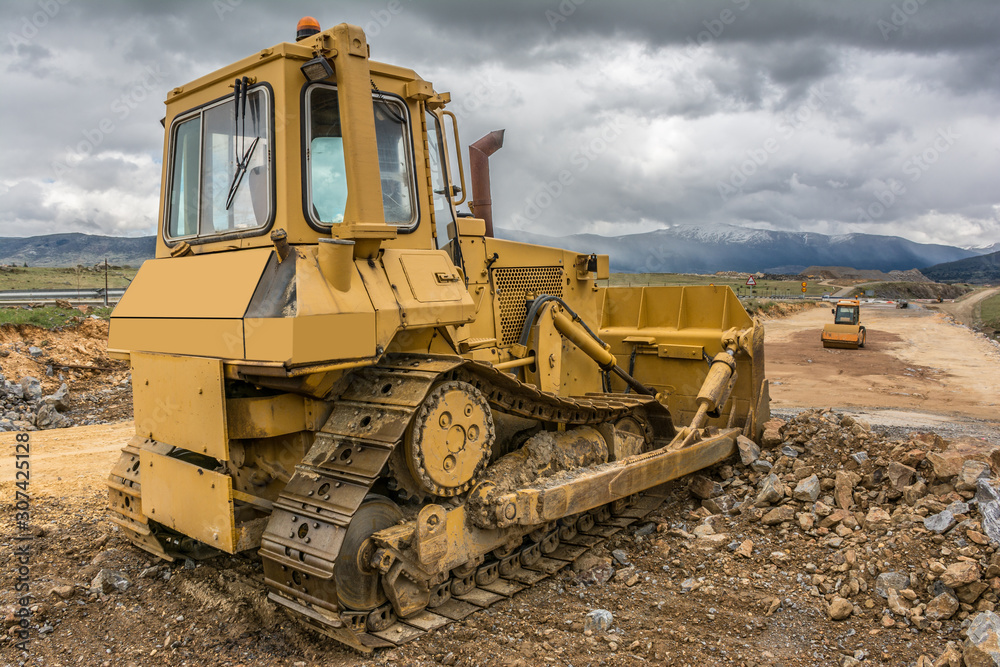 Machinery doing road construction work Machinery doing road construction work