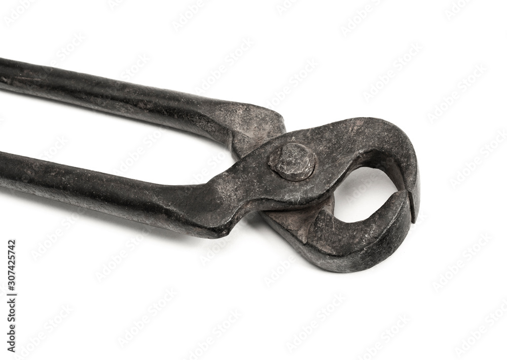 Old used iron nippers, for pulling and biting off nails and cutting metal close-up. Isolated on white background. Old used iron nippers, for pulling and biting off nails and cutting metal close-up. Isolated on white background.