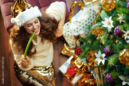 happy modern 40 year old woman eating celery