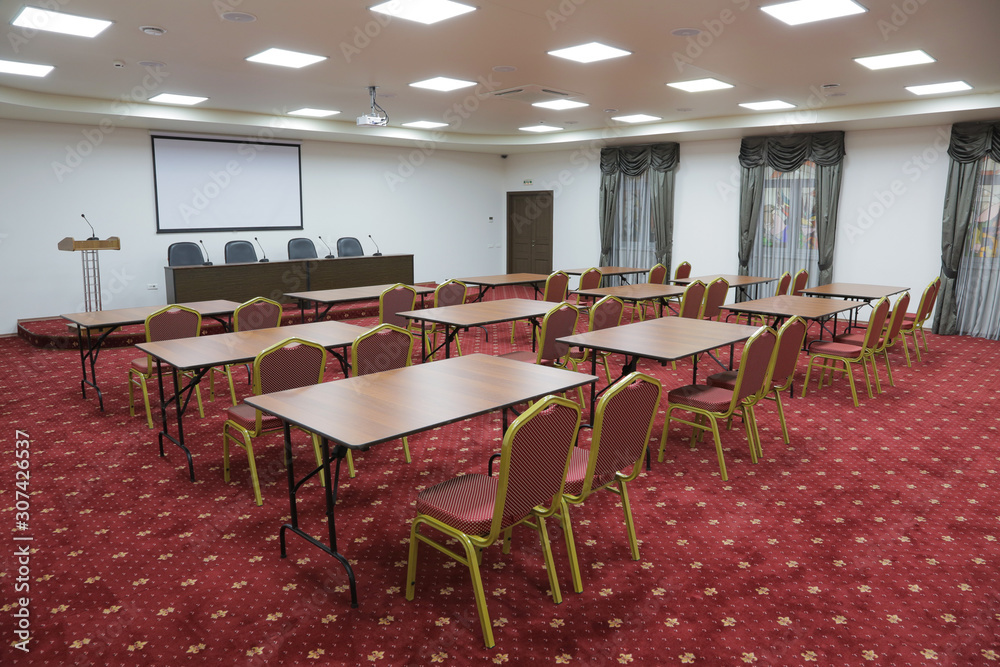 Prepared conference room for guests, with red carpet, clean, cozy, bright