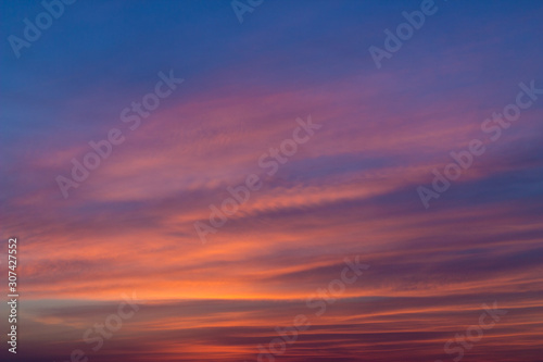 Bright colorful sky with cirrus clouds during sunrise