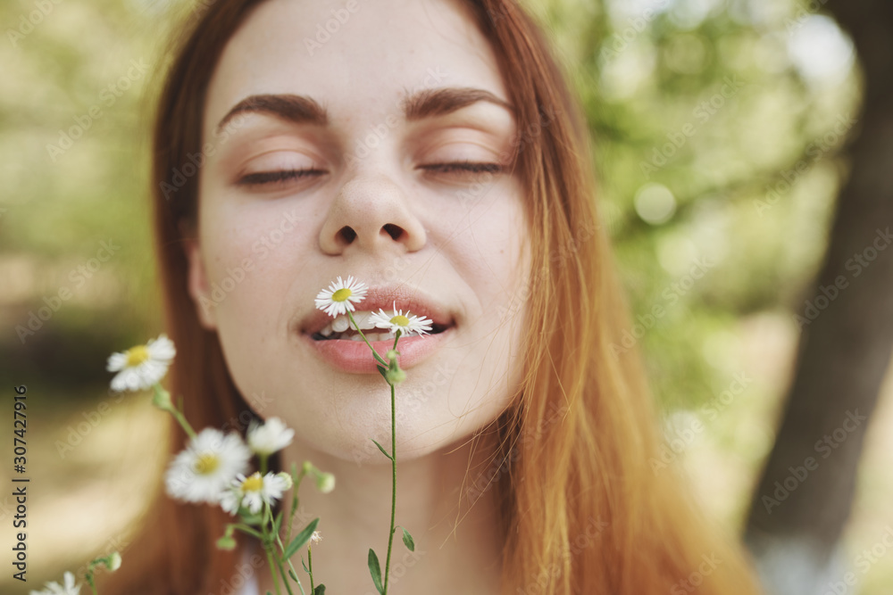 portrait of young woman with flower in her hair portrait of young woman with flower in her hair