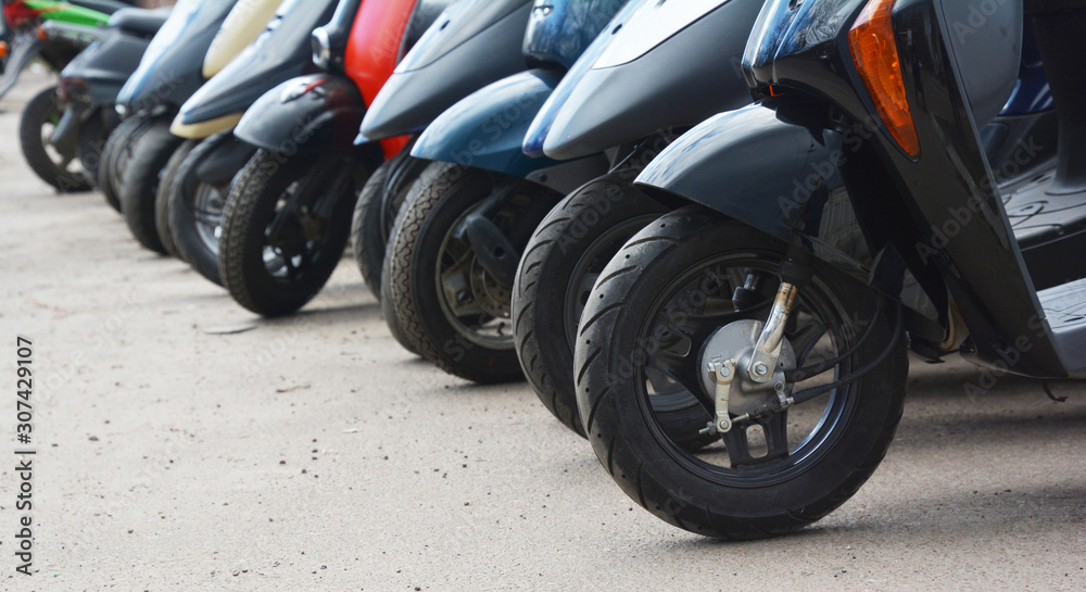 Parked motorbikes on the city street Parked motorbikes on the city street