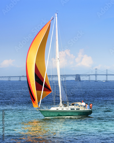 Colorful Sailboat in front of the Bay Bridge