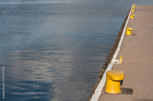 Harbour and quey with mooring posts photo