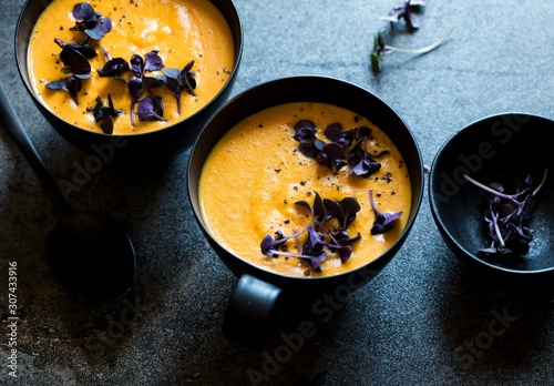 Close up of roasted vegetable soup served in bowls photo