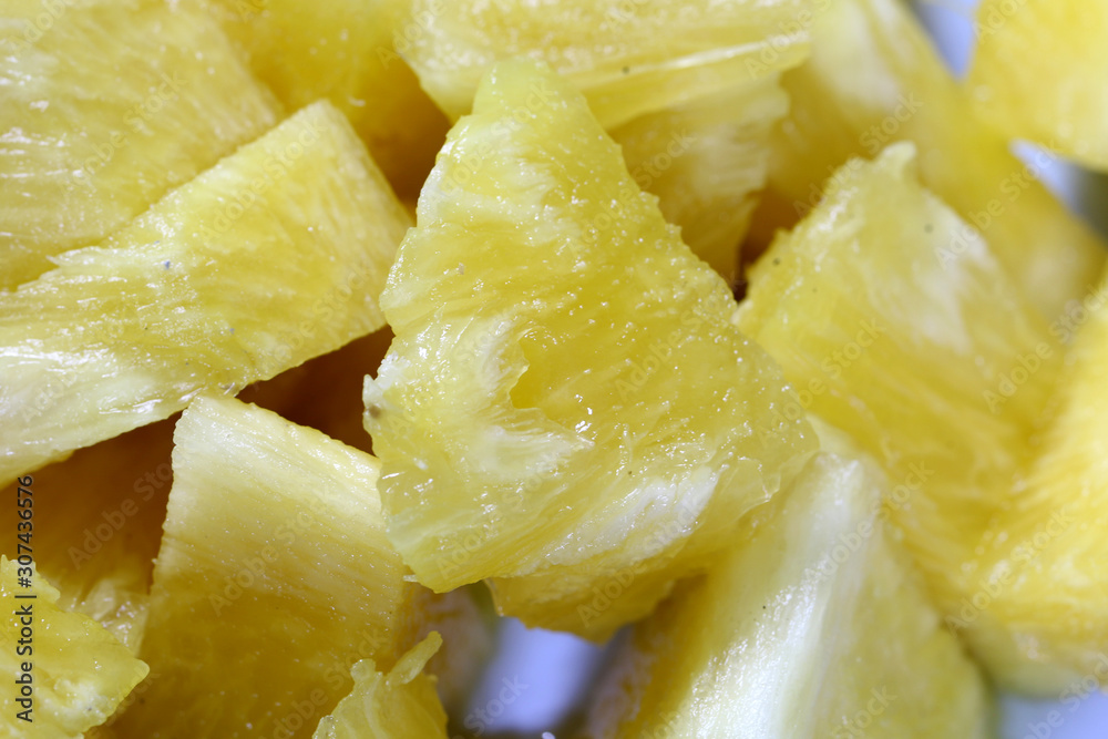Close up slice pineapple background texture in white dish. Slide and piece of fresh fruit. Close up slice pineapple background texture in white dish. Slide and piece of fresh fruit.