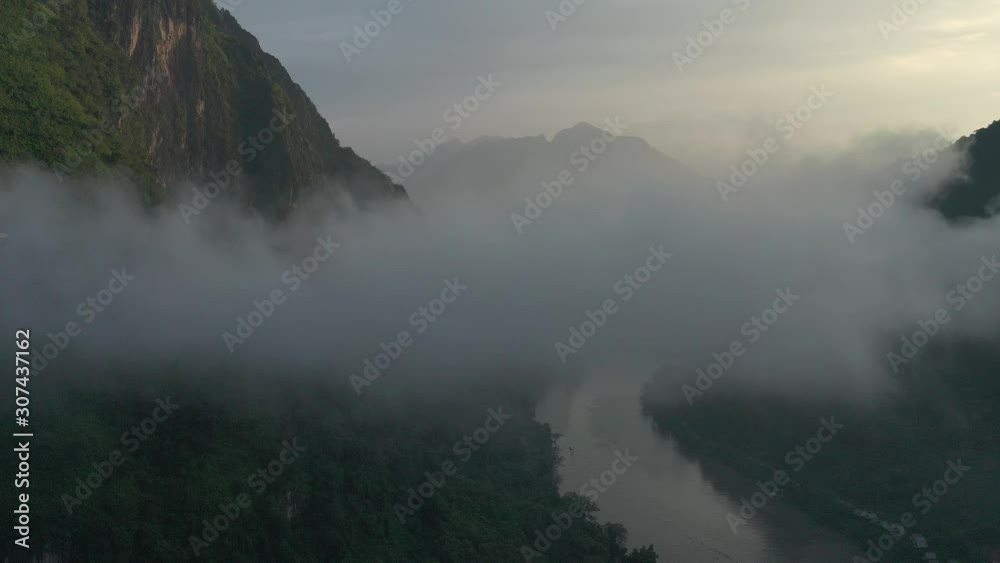 Aerial view of mountains and river Nong Khiaw. North Laos. Southeast Asia. Photo made by drone from above. Bird eye view. Aerial view of mountains and river Nong Khiaw. North Laos. Southeast Asia. Photo made by drone from above. Bird eye view.