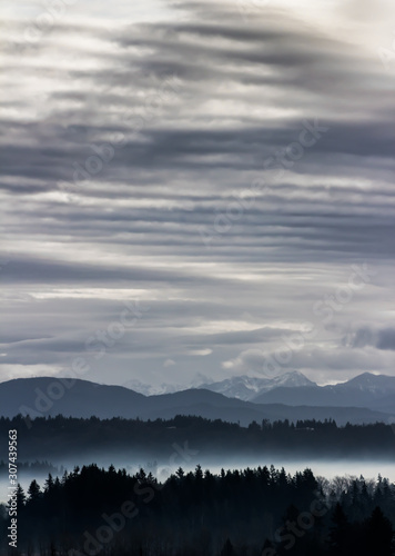 Cloudy foggy landscape and cloud patterns in Fraser Valley, Lower Mainland, British, Canada