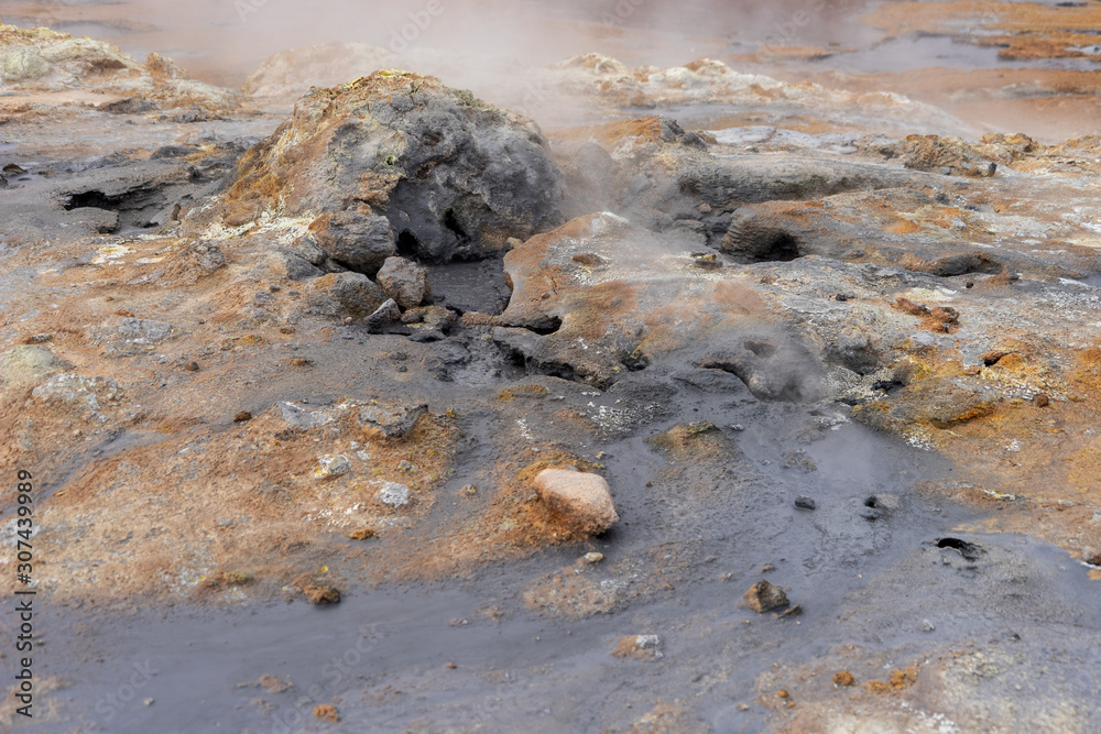 Hot mud pots in the Geothermal Area Hverir in Iceland. Europe Hot mud pots in the Geothermal Area Hverir in Iceland. Europe